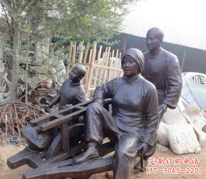 佛山推独轮车人物铜雕