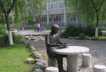 佛山坐石桌凳看书的学生铜雕